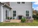 Outdoor patio with grill, seating, and a firepit, perfect for entertaining in the beautifully landscaped backyard at 4021 Brown Trout Dr, Johns Island, SC 29455