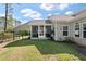 A spacious backyard with a screened-in porch that is perfect for relaxing outside at 4021 Brown Trout Dr, Johns Island, SC 29455