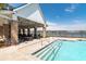 A community pool with a covered seating area and lake views at 4021 Brown Trout Dr, Johns Island, SC 29455