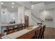 Dining area with wooden table and chairs, seamlessly connected to the kitchen and living room at 4021 Brown Trout Dr, Johns Island, SC 29455