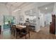 Well-lit dining room with wood table and chairs, and sliding door to a screened patio at 4021 Brown Trout Dr, Johns Island, SC 29455