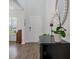 Inviting entryway with sleek flooring, black console, a large decorative mirror, and ample natural light at 4021 Brown Trout Dr, Johns Island, SC 29455