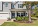 View of the front porch, which has well-placed landscaping and seating, inviting visitors to relax and enjoy the surroundings at 4021 Brown Trout Dr, Johns Island, SC 29455