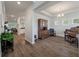 Open-concept living space boasts wood floors and recessed lighting, seamlessly connecting to other areas of the home at 4021 Brown Trout Dr, Johns Island, SC 29455