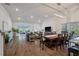 Bright, open-concept living room featuring hardwood floors and abundant natural light at 4021 Brown Trout Dr, Johns Island, SC 29455