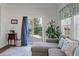 Inviting living room with sliding glass doors to the patio, hardwood floors, and stylish decor at 4021 Brown Trout Dr, Johns Island, SC 29455