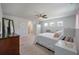 Bright main bedroom with three windows, comfortable bed, and plush decor at 4021 Brown Trout Dr, Johns Island, SC 29455