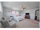 Spacious main bedroom featuring a ceiling fan, lots of natural light, and carpeted floors at 4021 Brown Trout Dr, Johns Island, SC 29455