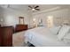 Serene main bedroom featuring tray ceilings, ample natural light, and a calming color palette at 4021 Brown Trout Dr, Johns Island, SC 29455