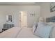 Comfortable main bedroom highlighting a tray ceiling, doorway, and calming decor at 4021 Brown Trout Dr, Johns Island, SC 29455