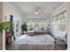 Serene sunroom with floor-to-ceiling windows, comfortable seating, and a tranquil view of the outdoors at 4021 Brown Trout Dr, Johns Island, SC 29455
