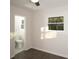 Bedroom featuring a ceiling fan, a window with natural light, and door to the bathroom at 412 Arlington Dr, Charleston, SC 29414