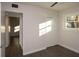 This bedroom features a ceiling fan, a closet, a window, with modern gray vinyl floors at 412 Arlington Dr, Charleston, SC 29414