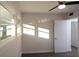 This bedroom features a ceiling fan, window with natural light, and door to the bathroom at 412 Arlington Dr, Charleston, SC 29414