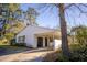 Classic white siding complements this lovely single-story home, featuring a convenient carport and well-kept lawn space at 412 Arlington Dr, Charleston, SC 29414