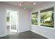 Bright and airy living room with hardwood floors, neutral walls, and sunny backyard views at 412 Arlington Dr, Charleston, SC 29414