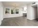 Sun-drenched living room featuring hardwood floors and views of the gazebo in the landscaped yard at 412 Arlington Dr, Charleston, SC 29414