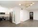 Open-concept living room with modern lighting, stainless steel appliances, and new hardwood floors at 412 Arlington Dr, Charleston, SC 29414