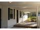 Inviting covered porch with brick flooring, perfect for relaxing and enjoying the neighborhood views at 412 Arlington Dr, Charleston, SC 29414