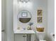 Elegant bathroom with a modern vanity, toilet, unique light fixtures, and fun decorations at 429 Pender Woods Dr, Summerville, SC 29486