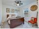 Cozy bedroom with hardwood sleigh bed, ceiling fan, and a decorative gallery wall at 429 Pender Woods Dr, Summerville, SC 29486