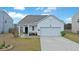 Charming single-Gathering home with a white exterior, attached garage, and well-maintained lawn and landscaped yard at 429 Pender Woods Dr, Summerville, SC 29486
