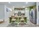 Stylish kitchen with a breakfast bar, granite countertops, stainless steel appliances, and modern lighting at 429 Pender Woods Dr, Summerville, SC 29486