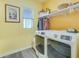 Bright laundry room featuring a modern washer/dryer, storage shelf, and natural light from a window at 429 Pender Woods Dr, Summerville, SC 29486