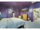 Comfortable main bedroom with a large bed, wooden dresser, and doorway view to a modern kitchen at 429 Pender Woods Dr, Summerville, SC 29486