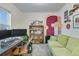 A functional office space with desk, comfortable couch, and creative decorations at 429 Pender Woods Dr, Summerville, SC 29486