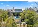 Aerial view of estate featuring a pool, waterfall, outdoor seating and beautiful brick architecture surrounded by lush foliage at 430 Fish Tale Rd, Charleston, SC 29492