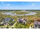 Waterfront home with marsh views, private boat dock, and lush greenery at 430 Fish Tale Rd, Charleston, SC 29492