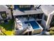 Stunning aerial view of a modern home with an outdoor lounge, dining area, and a sparkling blue pool at 430 Fish Tale Rd, Charleston, SC 29492