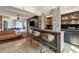 Luxurious bar area that combines a brick bar with a large screen TV for entertainment, integrating indoor and outdoor spaces at 430 Fish Tale Rd, Charleston, SC 29492