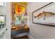 Stylish powder room with a unique brick wall, floating vanity, and decorative fish artwork at 430 Fish Tale Rd, Charleston, SC 29492