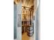 Unique bathroom design with a barrel sink, rustic wood paneling, and an outlaws-themed art, offering a novelty experience at 430 Fish Tale Rd, Charleston, SC 29492