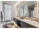 Bathroom featuring a double vanity with marble countertops, sleek gray cabinets, and a large, well-lit mirror at 430 Fish Tale Rd, Charleston, SC 29492