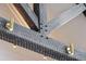 Detailed view of the interior ceiling's exposed wooden beams and custom lighting fixtures at 430 Fish Tale Rd, Charleston, SC 29492