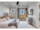 Modern bedroom with neutral tones, balcony, and views of the surrounding landscape at 430 Fish Tale Rd, Charleston, SC 29492