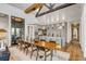 Open dining and kitchen area with wooden table, wine storage, and stone countertops at 430 Fish Tale Rd, Charleston, SC 29492