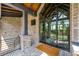 Elegant entrance featuring large glass doors, brickwork, and stylish design, creating a grand first impression at 430 Fish Tale Rd, Charleston, SC 29492