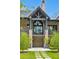 Close-up of brick entrance with transom and landscaping, and stepping stone walkway at 430 Fish Tale Rd, Charleston, SC 29492