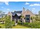 Charming brick home with lush landscaping, well-manicured lawn, and inviting curb appeal at 430 Fish Tale Rd, Charleston, SC 29492
