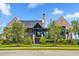Charming brick home with lush landscaping, inviting entryway, and a well-maintained lawn at 430 Fish Tale Rd, Charleston, SC 29492