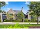 Stately brick home with lush landscaping, mature trees, and a circular driveway at 430 Fish Tale Rd, Charleston, SC 29492