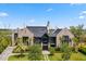 Beautiful brick home featuring a well-manicured lawn, lush landscaping, and a grand entrance at 430 Fish Tale Rd, Charleston, SC 29492