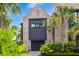 Beautiful brick facade with black trim, lush landscaping, and a well-manicured lawn at 430 Fish Tale Rd, Charleston, SC 29492