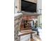Close-up of a modern fireplace with custom stonework and a beautifully styled mantel at 430 Fish Tale Rd, Charleston, SC 29492