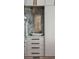 Stone backsplash behind gray kitchen cabinets with matching drawer and door hardware at 430 Fish Tale Rd, Charleston, SC 29492