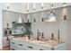 Spacious kitchen with gray cabinets, marble backsplash, countertop and stainless steel appliances at 430 Fish Tale Rd, Charleston, SC 29492